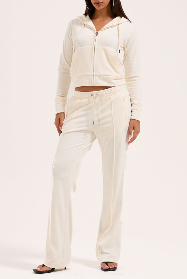 Pantaloni in velluto Tina con logo Juicy in strass colore Panna